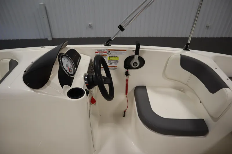 Slide: The Image of 2021 Bayliner 16 Element boat cockpit with steering wheel and seating. - 15
