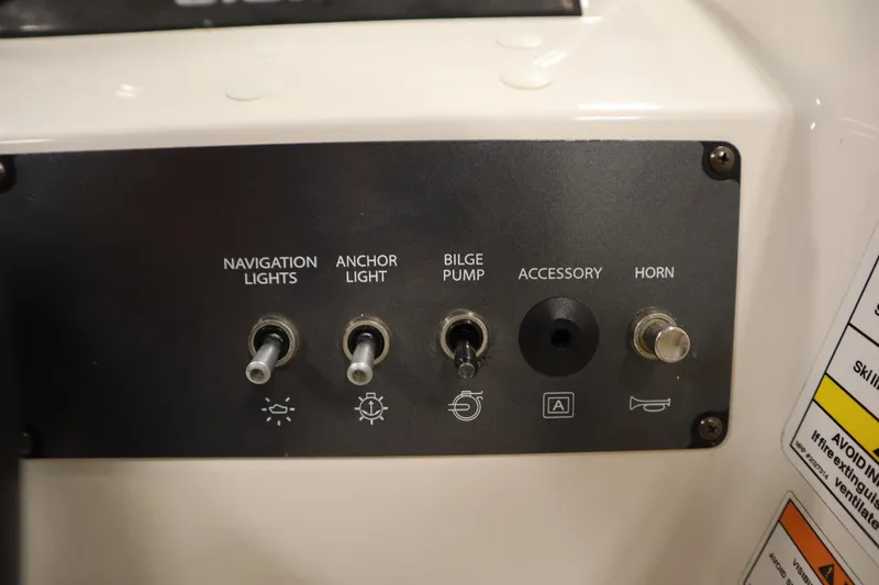 Slide: The Image of Control panel of 2021 Bayliner 16 Element boat with switches for lights, bilge pump, and horn. - 19