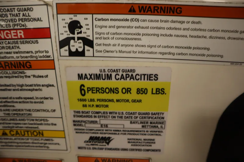 Slide: The Image of Warning labels on 2021 Bayliner 16 Element boat, highlighting carbon monoxide risks and capacity limits. - 20