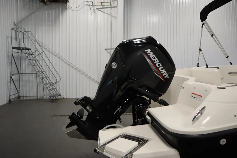 Slide: The Image of 2021 Bayliner 16 Element boat with Mercury outboard motor in a storage facility. - 32