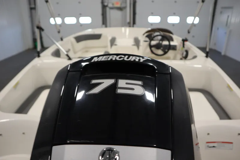 Slide: The Image of 2021 Bayliner 16 Element boat with Mercury 75 engine in a garage setting. - 33