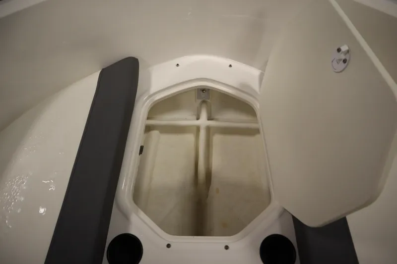 Slide: The Image of 2021 Bayliner 16 Element boat storage compartment with open hatch. - 12