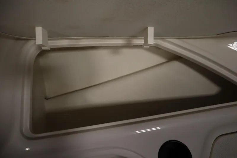 Slide: The Image of Storage compartment of a 2021 Bayliner 16 Element boat, open and empty. - 13