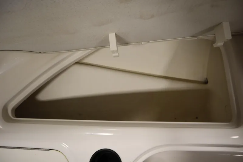 Slide: The Image of 2021 Bayliner 16 Element boat storage compartment, open and empty. - 14