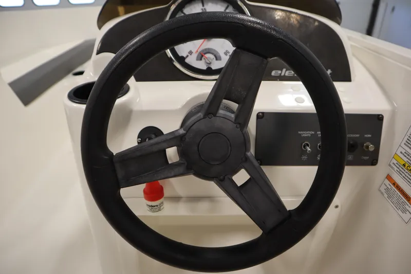 Slide: The Image of Steering wheel and dashboard of 2021 Bayliner 16 Element boat. - 17