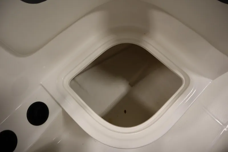 Slide: The Image of Storage compartment in 2021 Bayliner 16 Element boat, featuring sleek white interior design. - 25