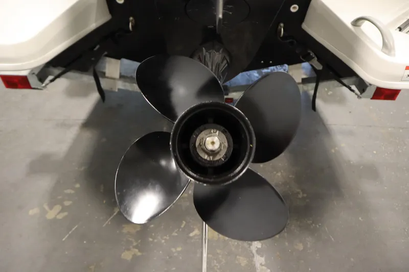 Slide: The Image of 2021 Bayliner 16 Element boat propeller, close-up view in a garage setting. - 34