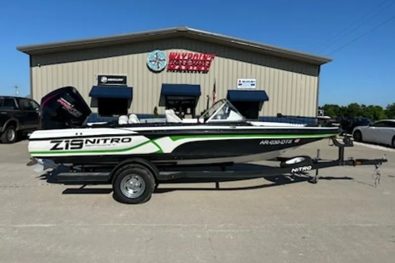 The Image of 2020 Nitro Z19 Sport boat on gravel lot under clear blue sky. - 1