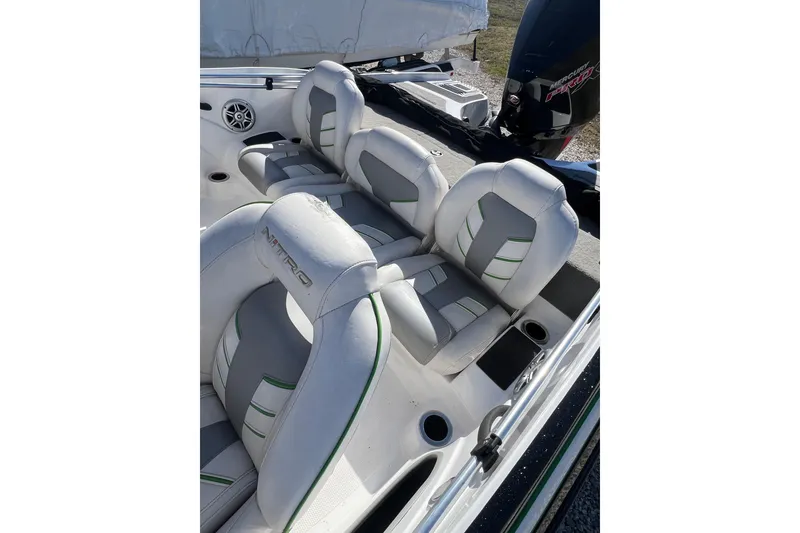 Slide: The Image of 2020 Nitro Z19 Sport boat interior with white and gray seating, green accents. - 12