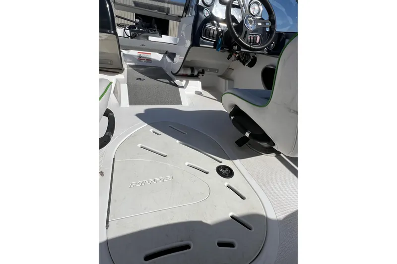 Slide: The Image of 2020 Nitro Z19 Sport boat interior with steering wheel and seating. - 15