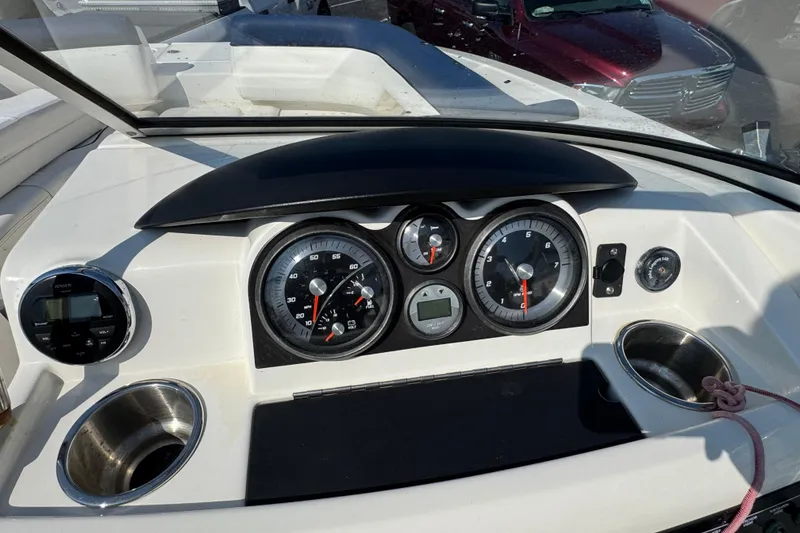 Slide: The Image of 2015 Bayliner 190 Deck Boat dashboard with gauges and controls. - 10