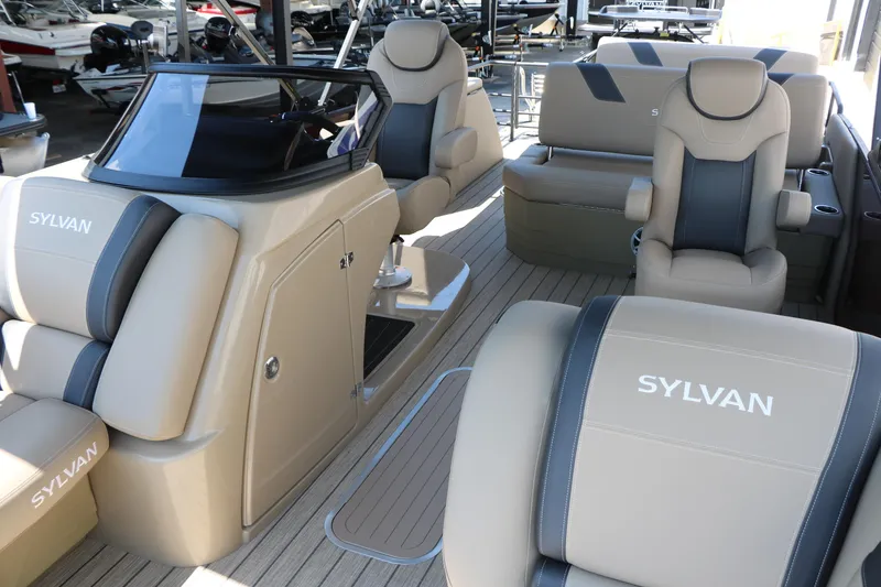 Slide: The Image of 2025 Sylvan L3 DLZ pontoon boat interior with beige and gray seating. - 18