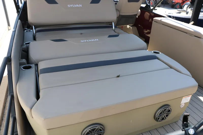 Slide: The Image of 2025 Sylvan L3 DLZ boat interior with beige seating and cup holders. - 20