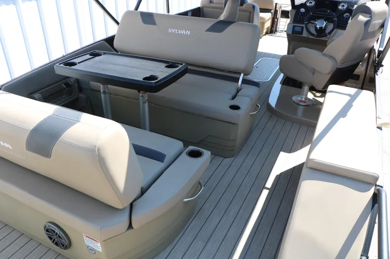 Slide: The Image of 2025 Sylvan L3 DLZ pontoon boat interior with seating and steering console. - 27