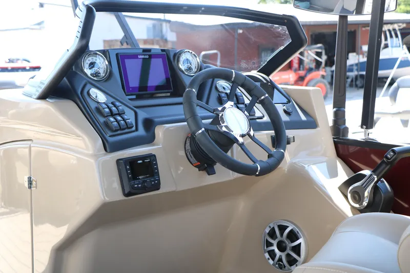 Slide: The Image of 2025 Sylvan L3 DLZ boat dashboard with steering wheel and control panel. - 29