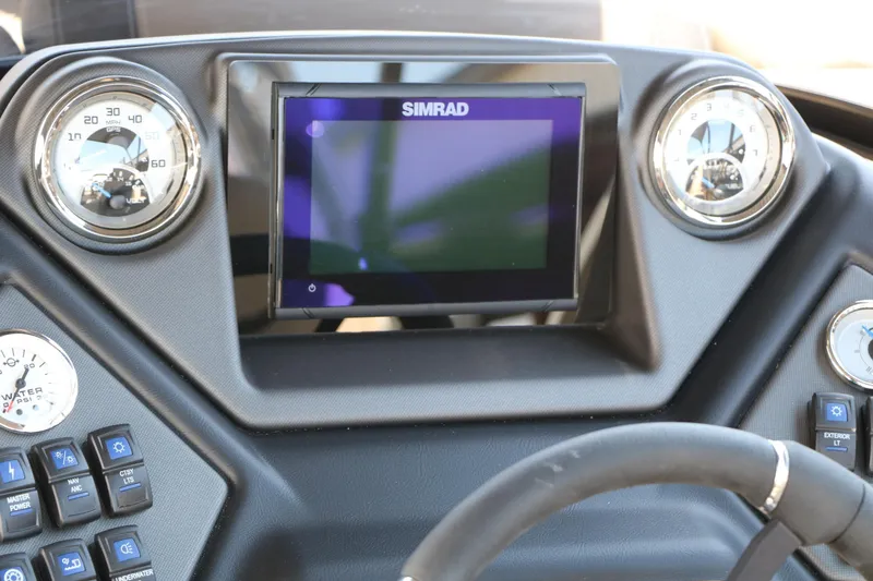 Slide: The Image of Dashboard of 2025 Sylvan L3 DLZ boat with Simrad display and gauges. - 32