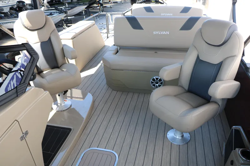 Slide: The Image of 2025 Sylvan L3 DLZ boat interior with beige seating and modern design. - 35