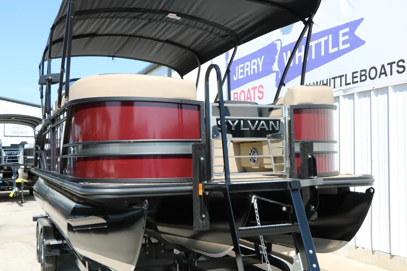 Slide: The Image of 2025 Sylvan L3 DLZ pontoon boat with red exterior at dealership. - 7