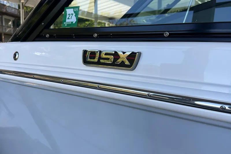 Slide: The Image of 2020 Chaparral 300 OSX boat emblem with Missouri registration sticker. - 17
