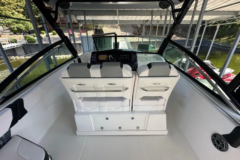 Slide: The Image of 2020 Chaparral 300 OSX boat interior with dual seats and modern dashboard. - 21