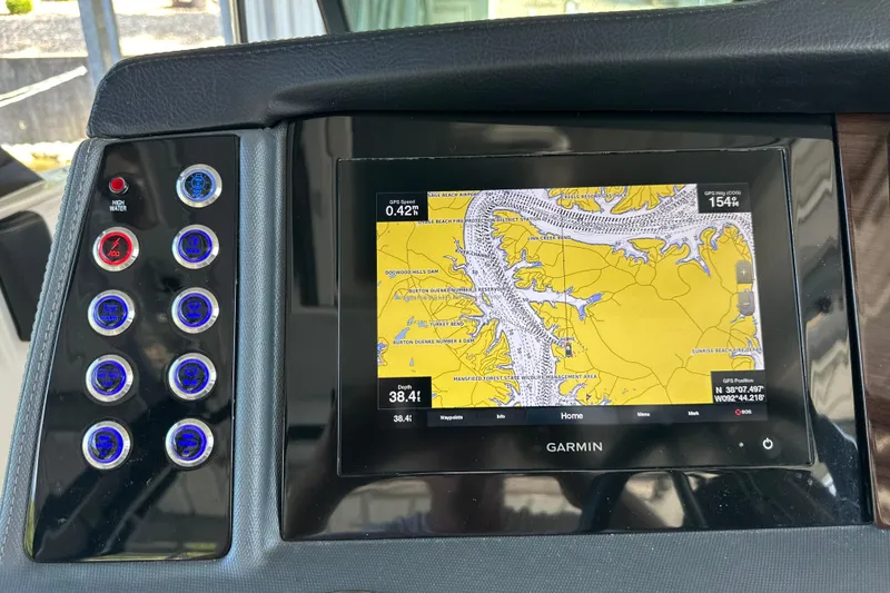 Slide: The Image of Dashboard of a 2020 Chaparral 300 OSX with Garmin navigation display. - 25