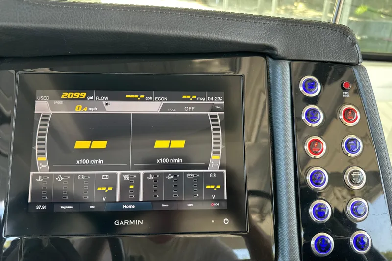Slide: The Image of Dashboard of 2020 Chaparral 300 OSX boat with Garmin display and control buttons. - 26