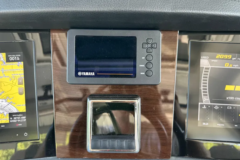 Slide: The Image of Dashboard of 2020 Chaparral 300 OSX with Yamaha display and navigation screens. - 27