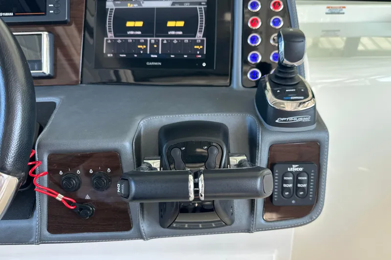 Slide: The Image of 2020 Chaparral 300 OSX boat dashboard with controls and Garmin display. - 28