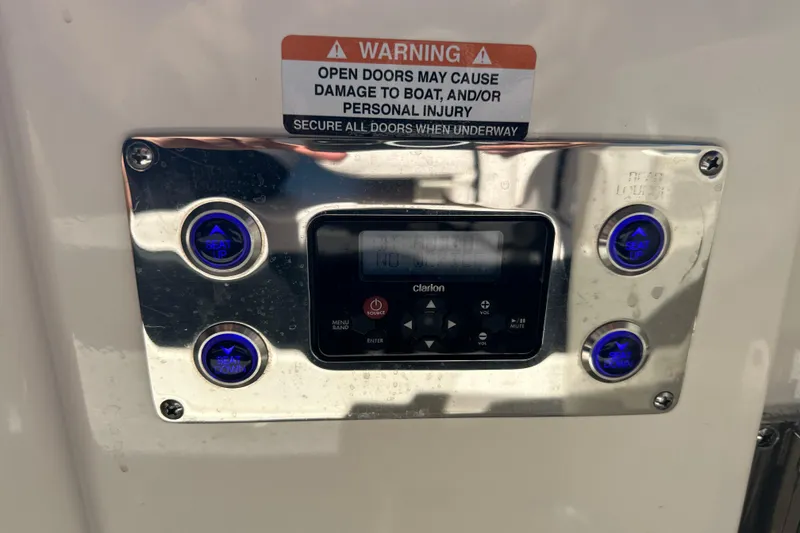 Slide: The Image of Control panel on a 2020 Chaparral 300 OSX boat with seat adjustment buttons. - 38