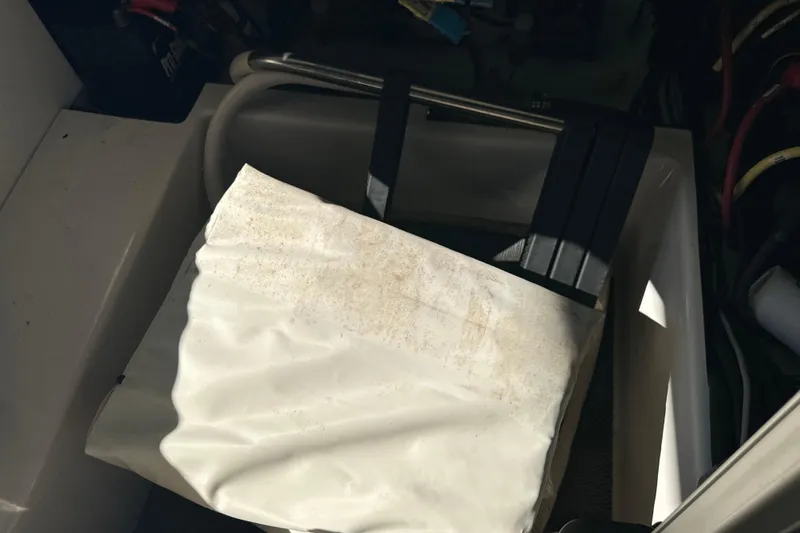 Slide: The Image of 2020 Chaparral 300 OSX boat interior with storage compartment and equipment. - 58