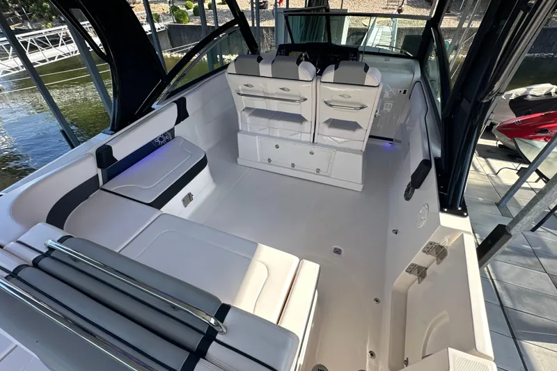 Slide: The Image of 2020 Chaparral 300 OSX boat interior with sleek seating and modern design. - 64