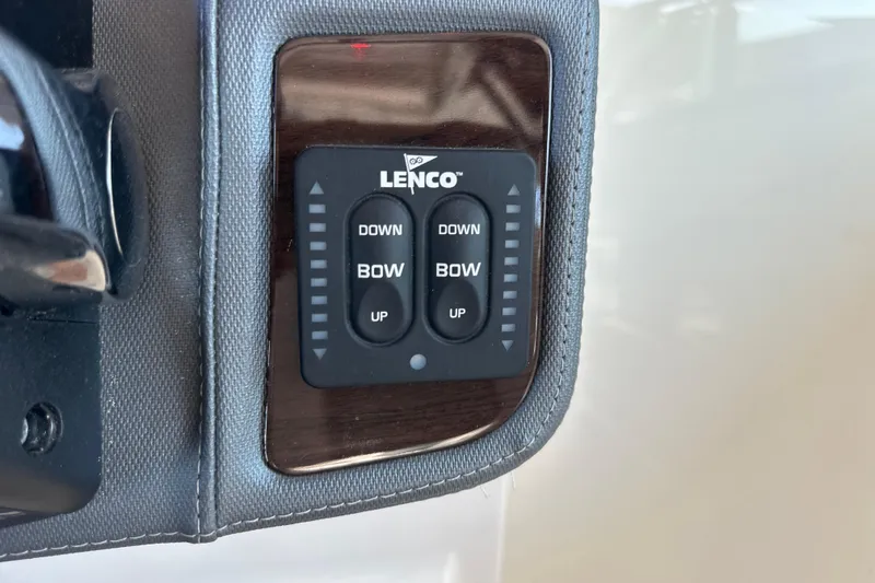 Slide: The Image of Lenco trim tab control panel on 2020 Chaparral 300 OSX boat dashboard. - 73