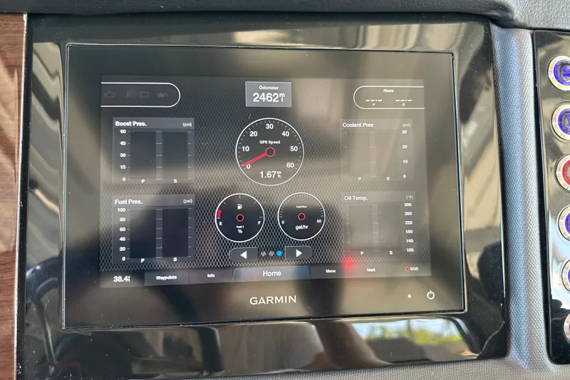 Slide: The Image of Garmin display on 2020 Chaparral 300 OSX showing engine metrics and odometer reading. - 77