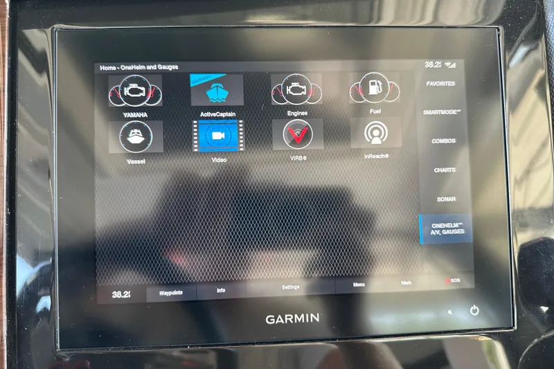 Slide: The Image of Garmin display on 2020 Chaparral 300 OSX boat showing navigation and engine controls. - 78