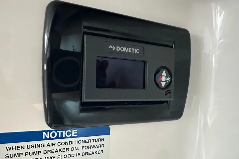 Slide: The Image of Dometic control panel in 2020 Chaparral 300 OSX boat interior. - 80
