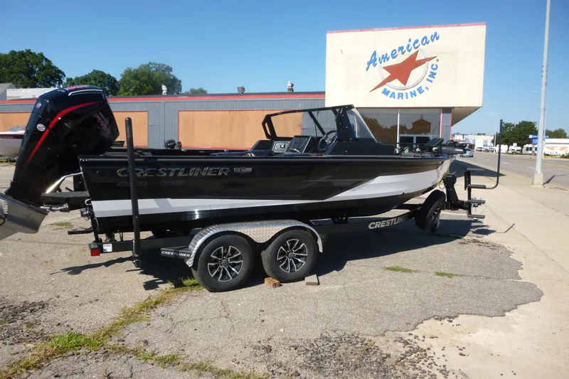 Slide: The Image of 2026 Crestliner 2050 Fish Hawk boat on trailer outside American Marine Inc. - 6