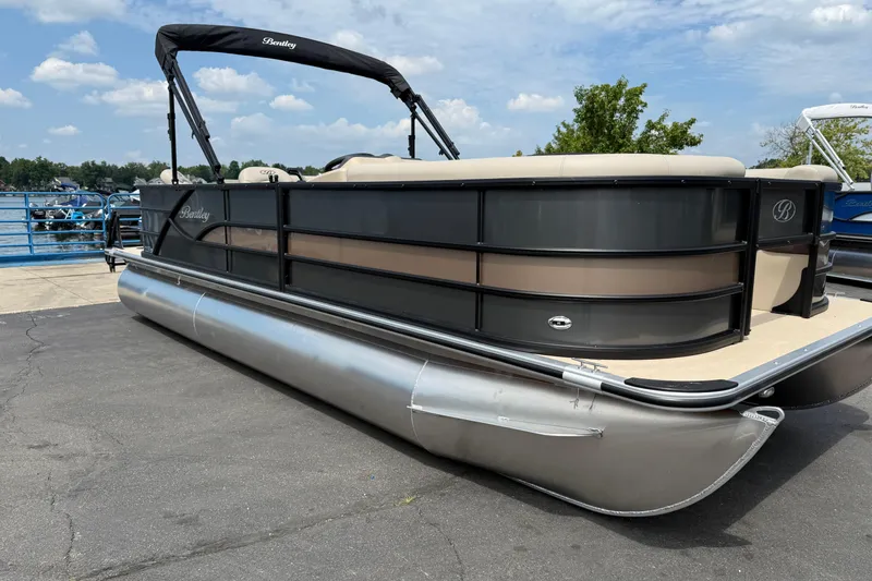 Slide: The Image of 2026 Bentley Pontoons Fish 220 Fish-N-Cruise pontoon boat docked on a sunny day. - 1