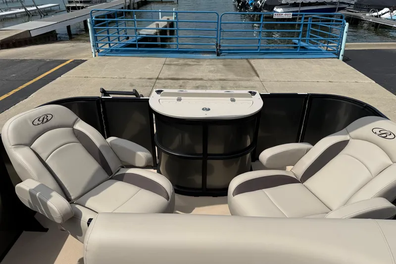 Slide: The Image of 2026 Bentley Pontoons Fish 220 Fish-N-Cruise with luxurious seating at a marina. - 10
