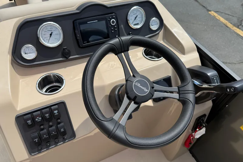 Slide: The Image of 2026 Bentley Pontoons Fish 220 Fish-N-Cruise dashboard with steering wheel and controls. - 12