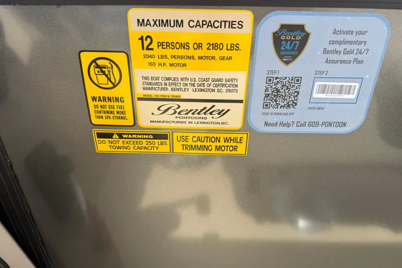 Slide: The Image of 2026 Bentley Pontoons Fish 220 Fish-N-Cruise capacity and safety warning labels. - 14