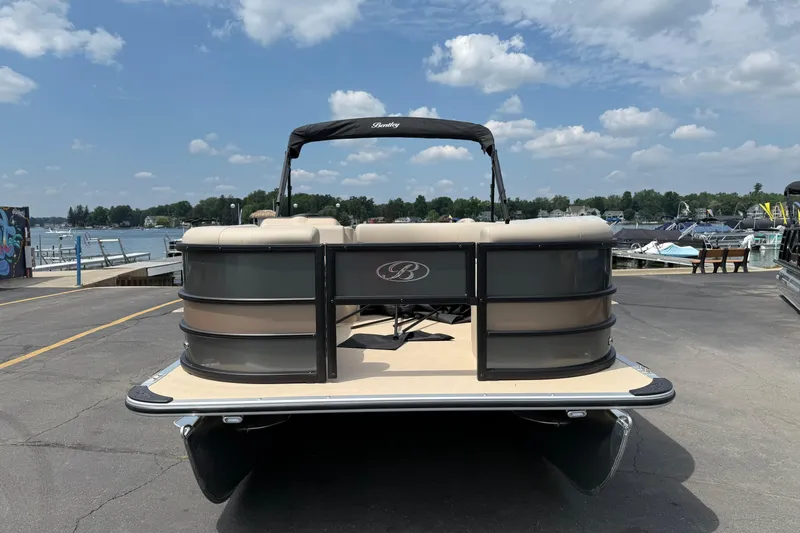 Slide: The Image of 2026 Bentley Pontoons Fish 220 Fish-N-Cruise at a marina under a cloudy sky. - 2