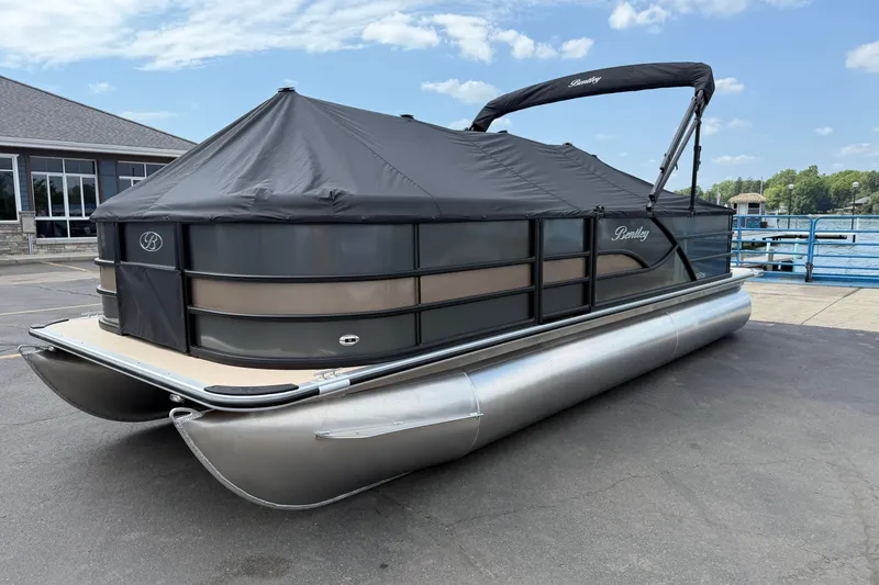 Slide: The Image of 2026 Bentley Pontoons Fish 220 Fish-N-Cruise with cover, docked by a lakeside. - 8