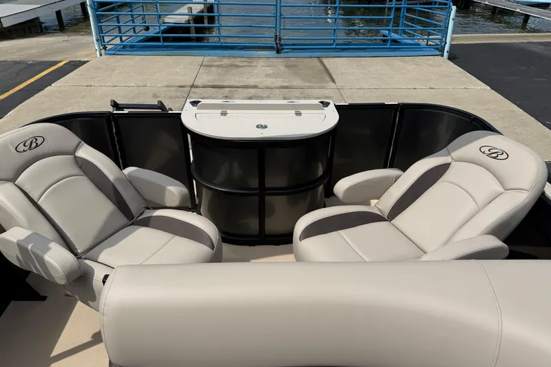 Slide: The Image of 2026 Bentley Pontoons Fish 220 Fish-N-Cruise interior with plush seating and fishing station. - 9