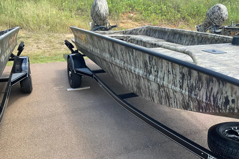Slide: The Image of 2026 Excel 1751 Viper F4 boat with camouflage design on a trailer. - 3