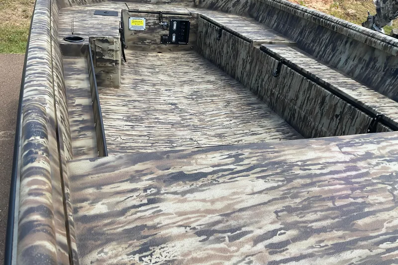 Slide: The Image of 2026 Excel 1751 Viper F4 boat interior with camouflage design and seating. - 4