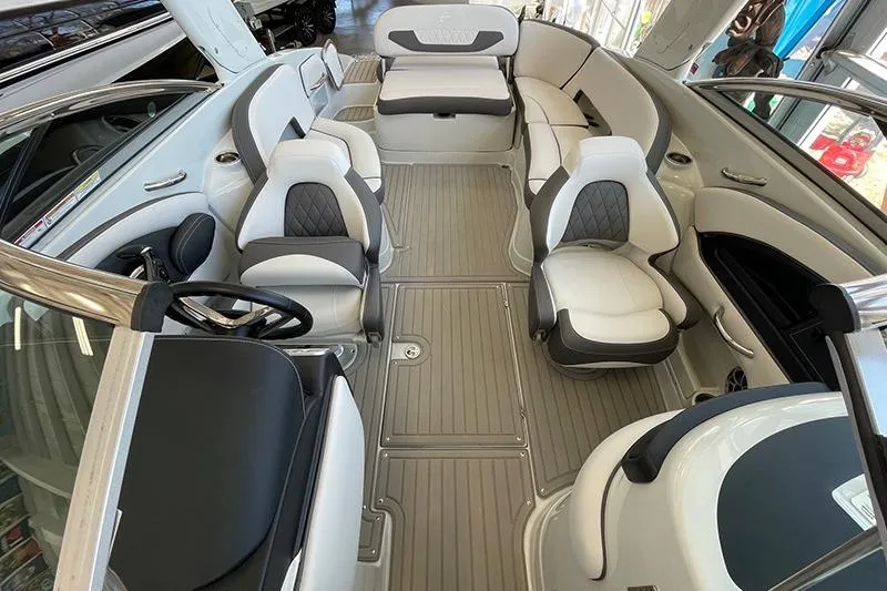 Slide: The Image of 2024 Crownline 290SS boat interior with luxurious seating and modern design. - 3