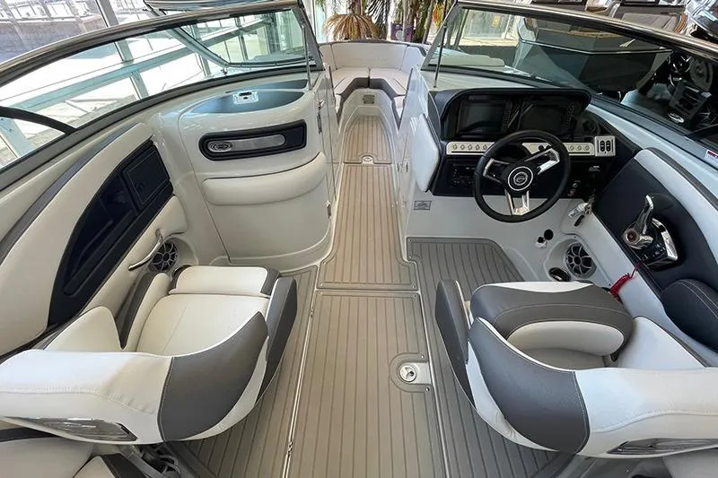 Slide: The Image of 2024 Crownline 290SS boat interior with modern seating and sleek dashboard design. - 6