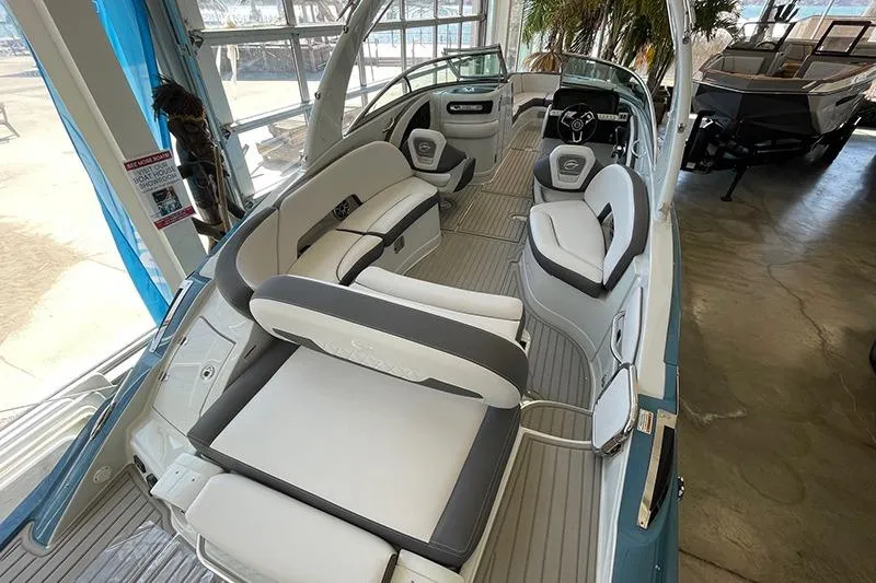 Slide: The Image of 2024 Crownline 290SS boat interior with luxurious seating and modern design. - 7