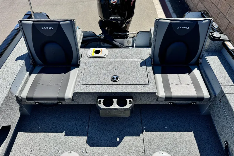 Slide: The Image of 2024 Lund 1775 Adventure Sport boat interior with two seats and motor. - 11