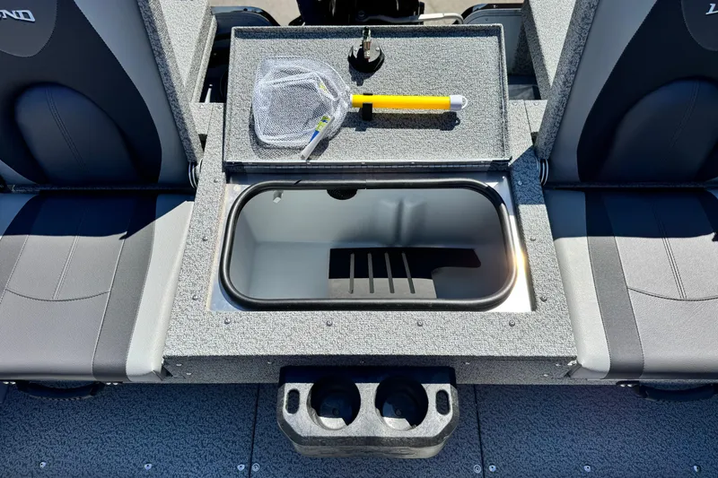 Slide: The Image of 2024 Lund 1775 Adventure Sport boat interior with storage compartment and seating. - 13